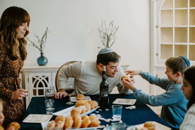 family celebrating hanukkah