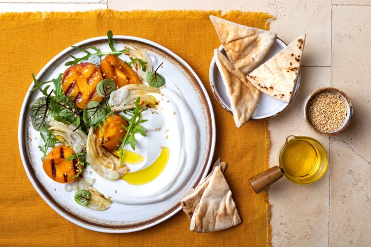 Topview of fennel apricot grilled barbecue salad with Labneh