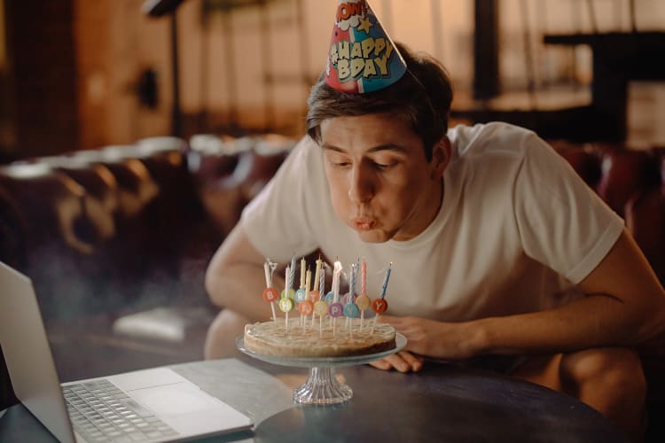 blowing out the candles during a virtual birthday party