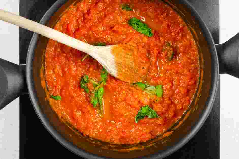 Sugo (Italian Tomato Sauce) Recipe: Bring the sauce to a simmer and cover.