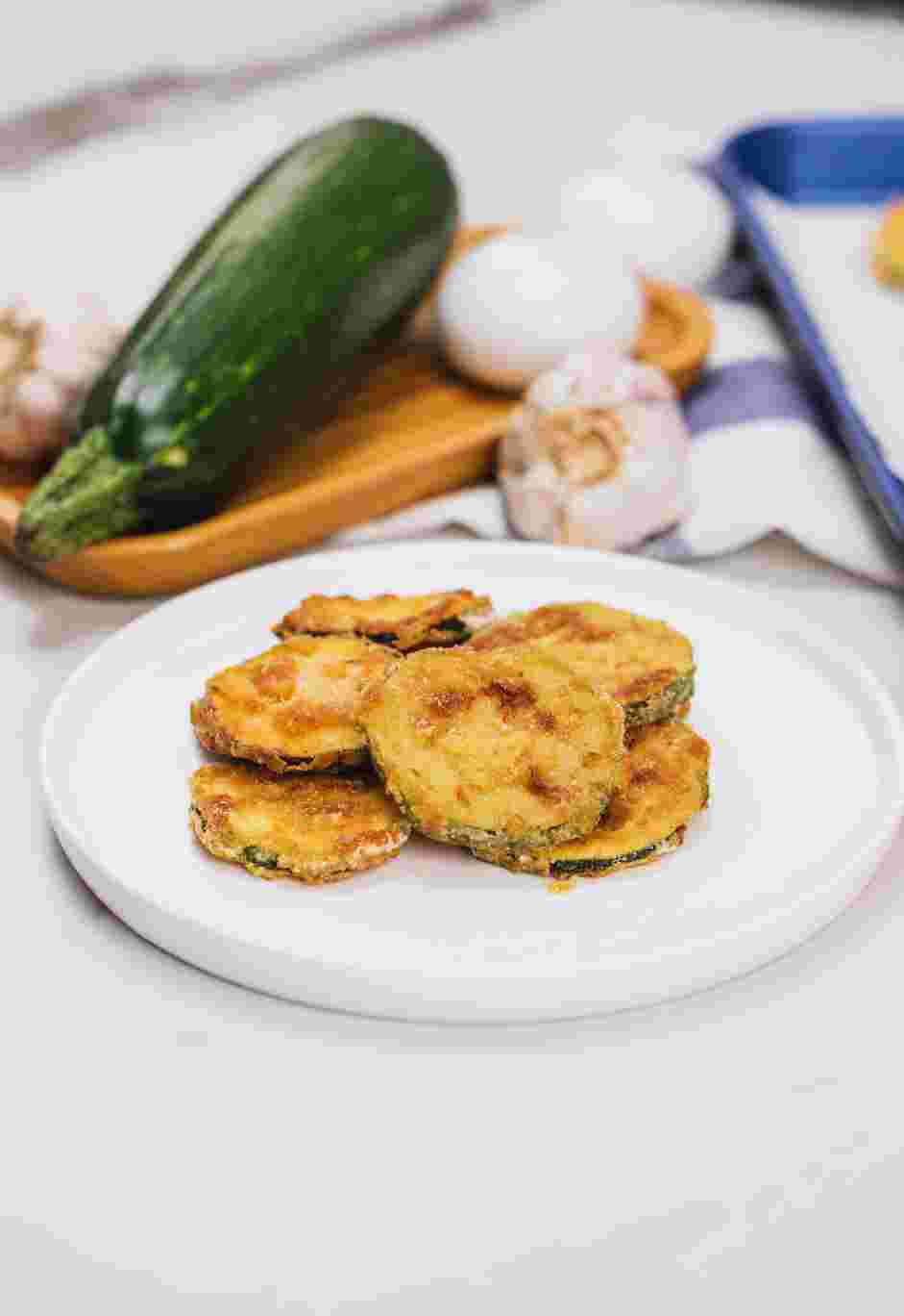 Fried Squash Recipe: Fry squash slices in batches until golden brown on both sides.