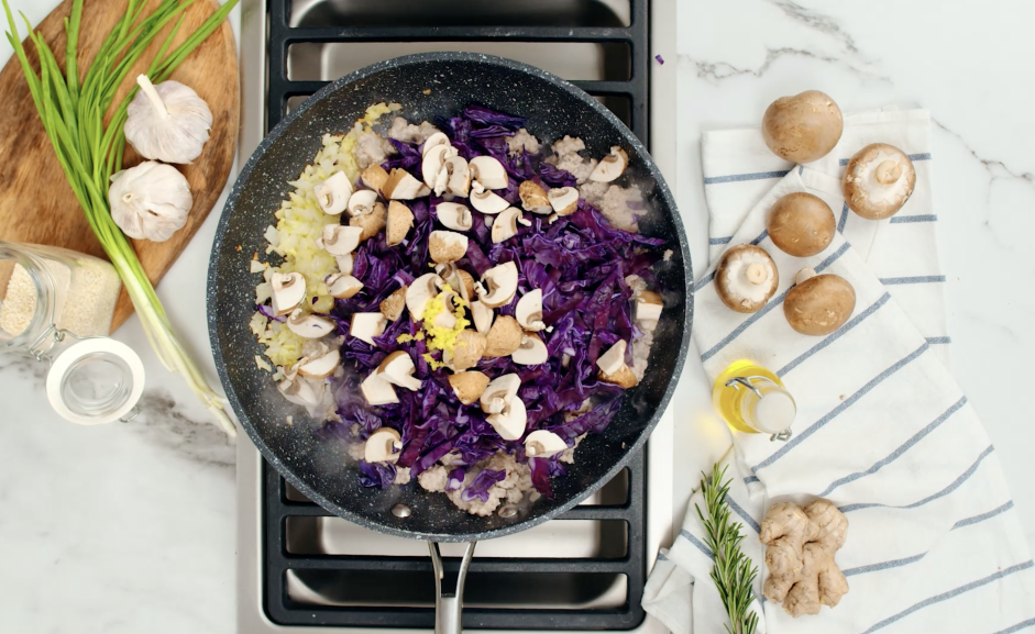 Crack Slaw (Egg Roll Bowl) Recipe: Add the ginger, mushrooms and cabbage to the pan.