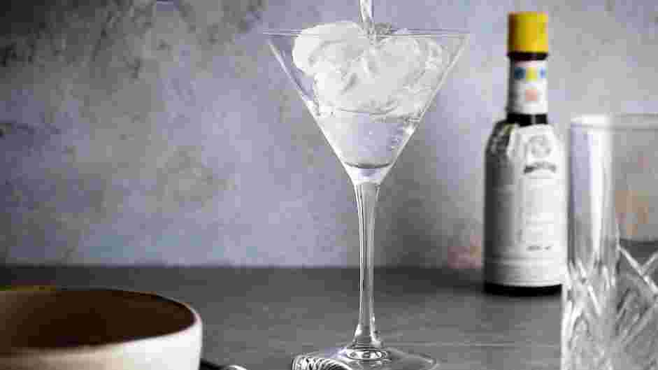 Black Manhattan Recipe: Fill a martini glass with ice and water to keep it cold.