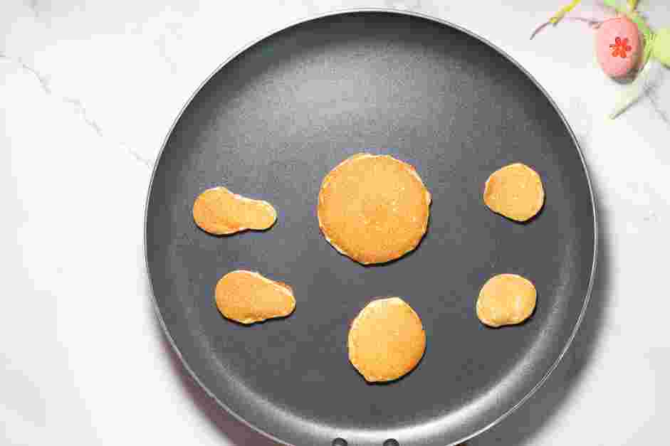 Bunny Pancakes Recipe: Lightly grease the skillet and make the bunny shapes.