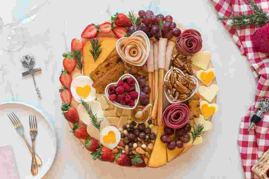 Date Night Charcuterie Board Recipe: Arrange sliced strawberries alongside one half of your board or around the full board in a heart shape.