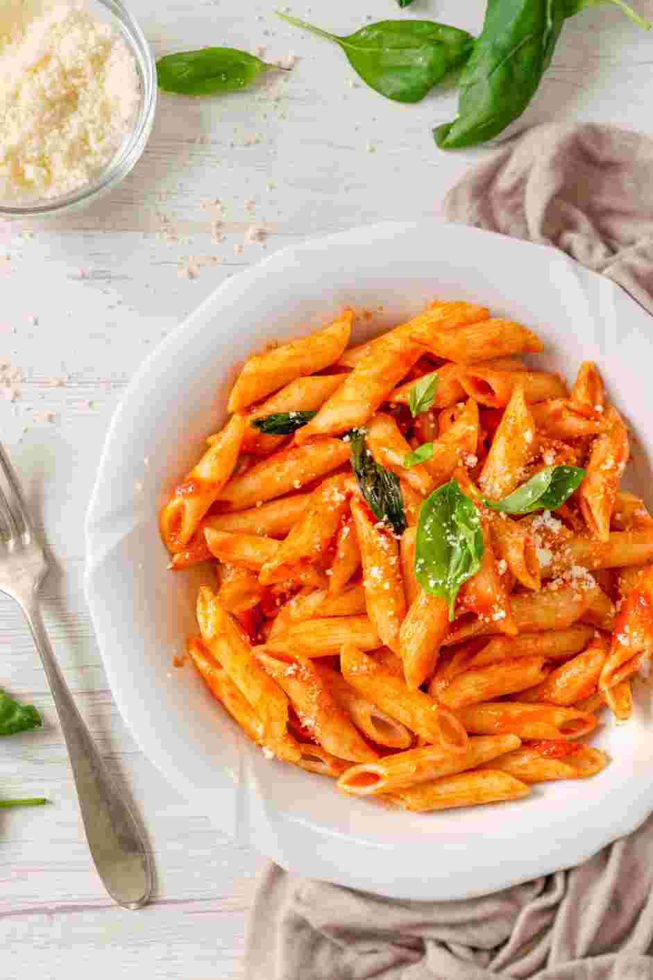 Penne Pomodoro Recipe: Garnish with additional fresh basil and grated Parmesan cheese.