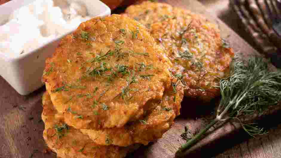 German Potato Pancakes Recipe: Serve with a garnish of fresh dill and sour cream or applesauce on the side for dipping.