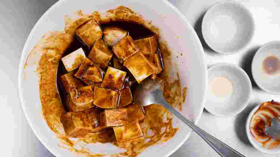 Air Fryer Tofu Recipe: Toss tofu cubes in the sauce until evenly coated and marinate for at least 20 minutes.