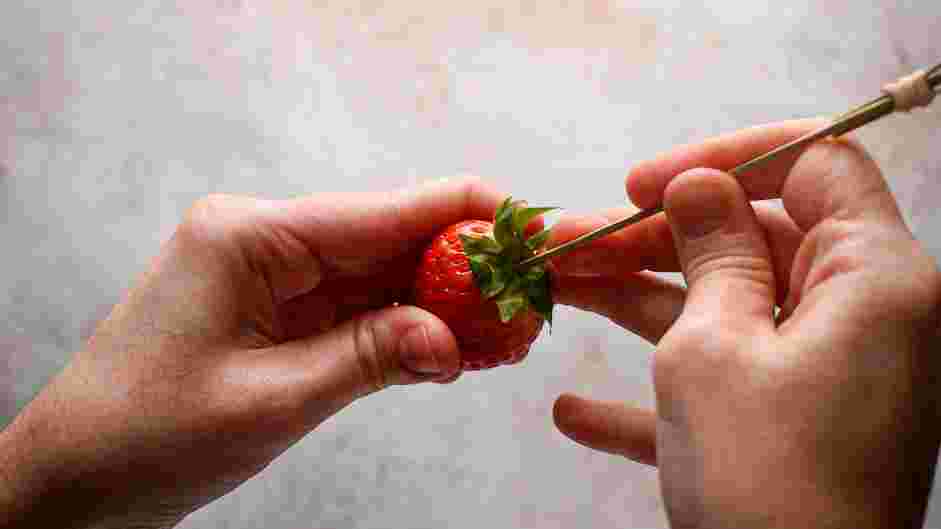 Candied Strawberries Recipe: Insert skewers into each strawberry through the top of the strawberry and 3/4 the way through.