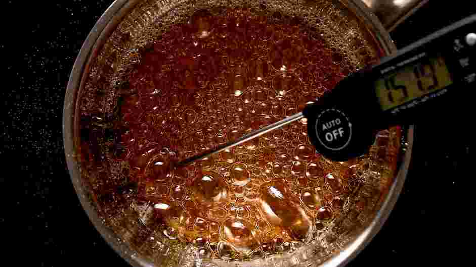 Candied Strawberries Recipe: Once it is boiling, reduce to medium and keep watching the temperature, once it reaches 150°C/300°F lower to the lowest heat and begin making the candied strawberries immediately.