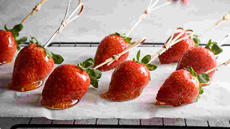 Candied Strawberries Recipe: Drip excess sugar and place strawberries on the parchment paper (or silicone mat).