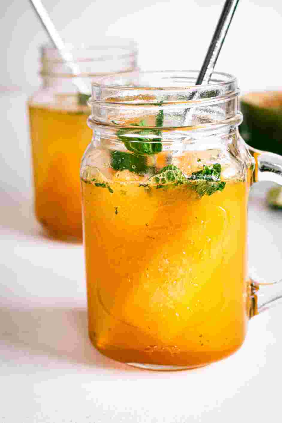 Passion Fruit Mojito Recipe: Evenly divide and pour the passion fruit mojito into the glasses and top each with soda water.