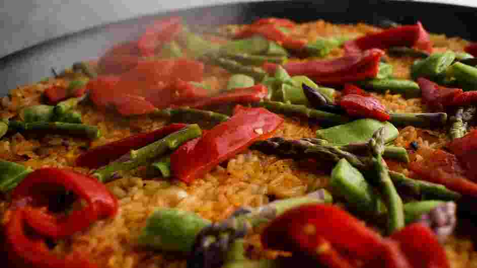 Vegan Paella Recipe: Turn down the heat and maintain a medium simmer.