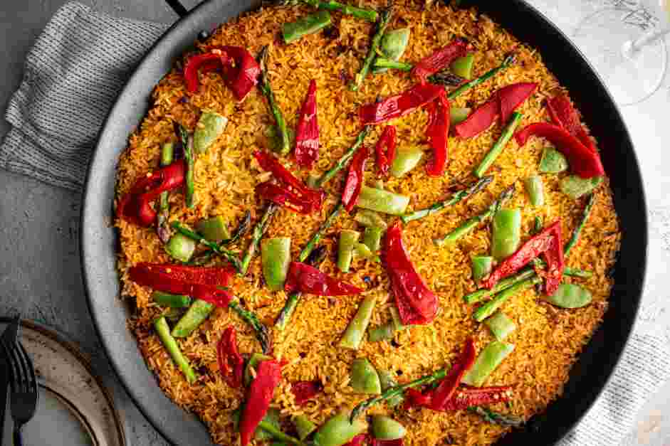 Vegan Paella Recipe: Continue cooking until almost all the liquid is absorbed, and the rice begins to look a bit &ldquo;sticky.