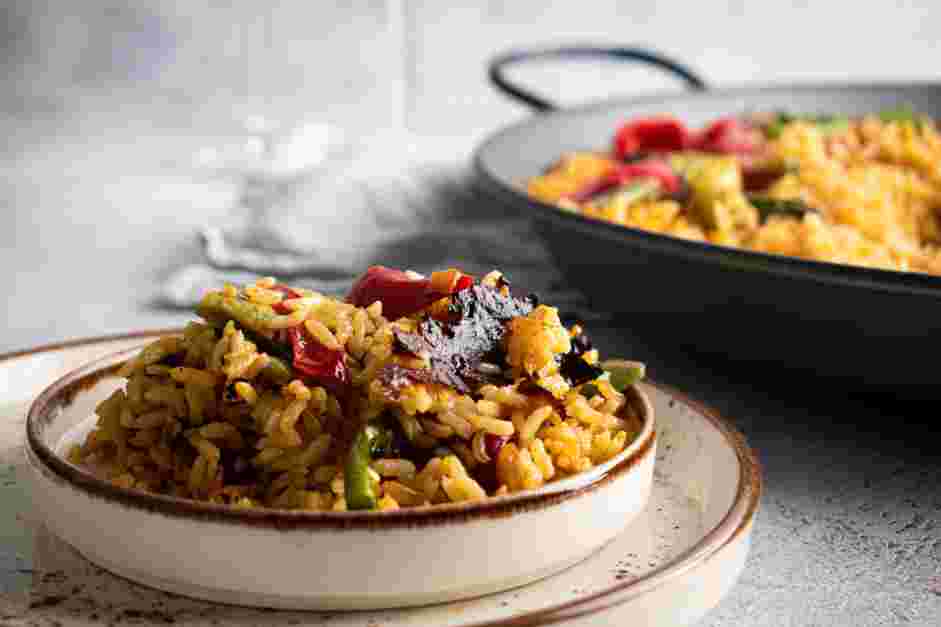 Vegan Paella Recipe: Garnish with thinly sliced lemon pieces.