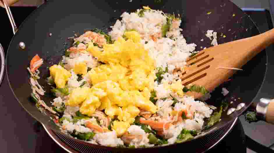 Crab Fried Rice Recipe: Once the rice is coated with the oil, mix all of the ingredients in the pan together.