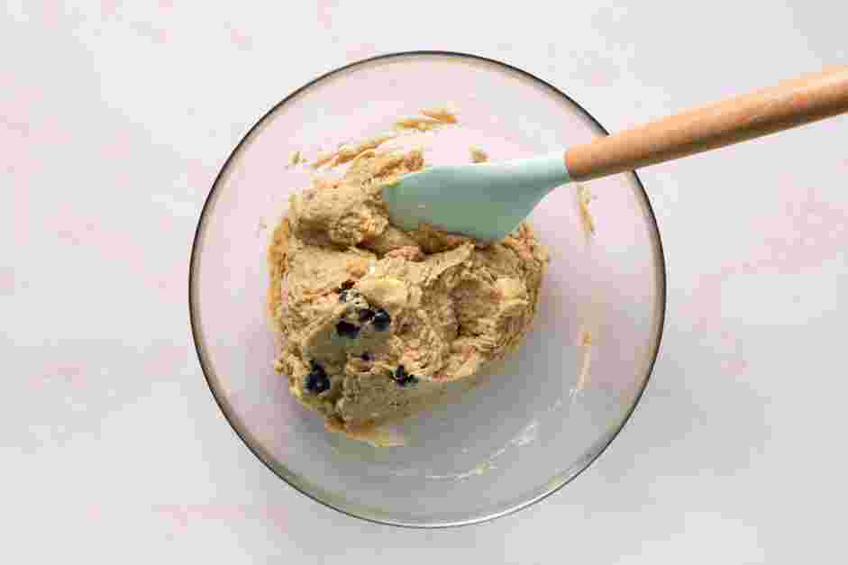 Chickpea Cookie Dough Recipe: Transfer the dough to a bowl and fold in the white chocolate pieces and blueberries.