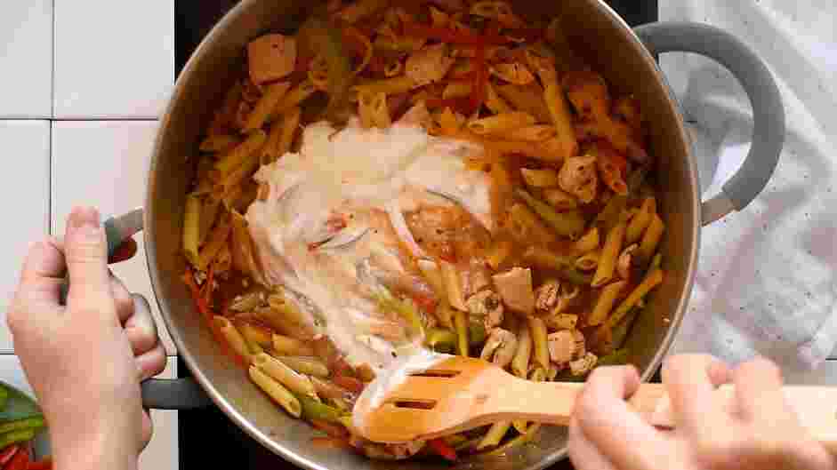 Rasta Pasta Recipe: Add the heavy cream and stir until combined.