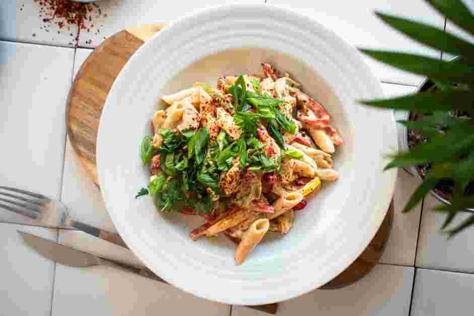 Rasta Pasta Recipe: Garnish with green onions, fresh cilantro and red pepper flakes.