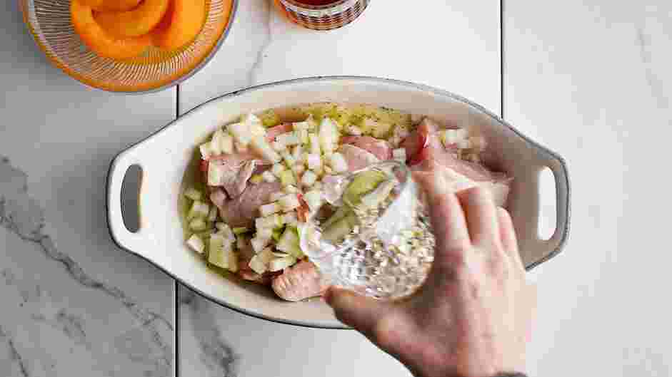 Peach Bourbon Chicken Recipe: Add onion, water and white wine to the chicken.