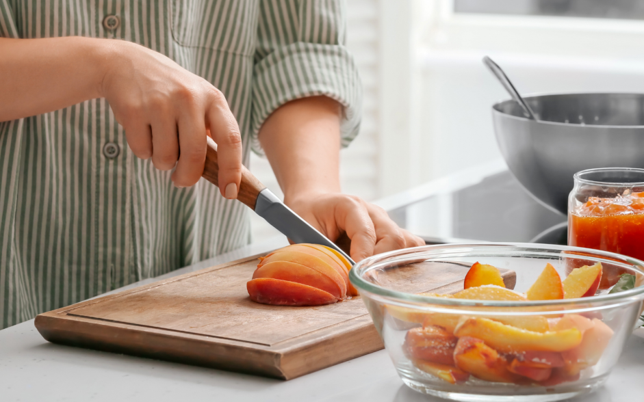 Peach Bourbon Chicken Recipe: While the chicken is roasting, peel and chop the fresh peaches into small cubes.