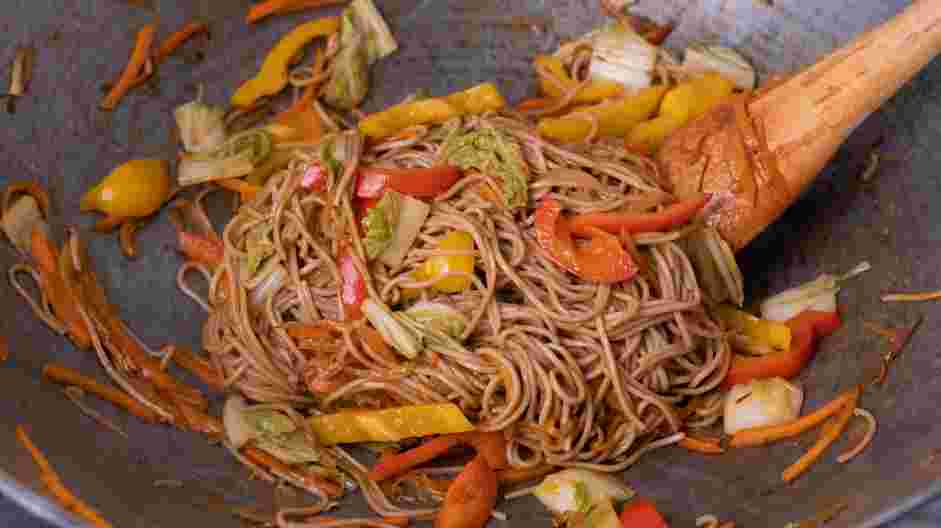 Hakka Noodles Recipe: Toss the noodles and stir-fry sauce into the wok and combine until the noodles are well-coated.