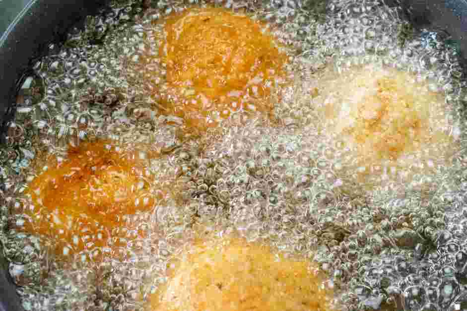 Italian Rice Balls Recipe: Heat the oil in a deep skillet to 350°F.