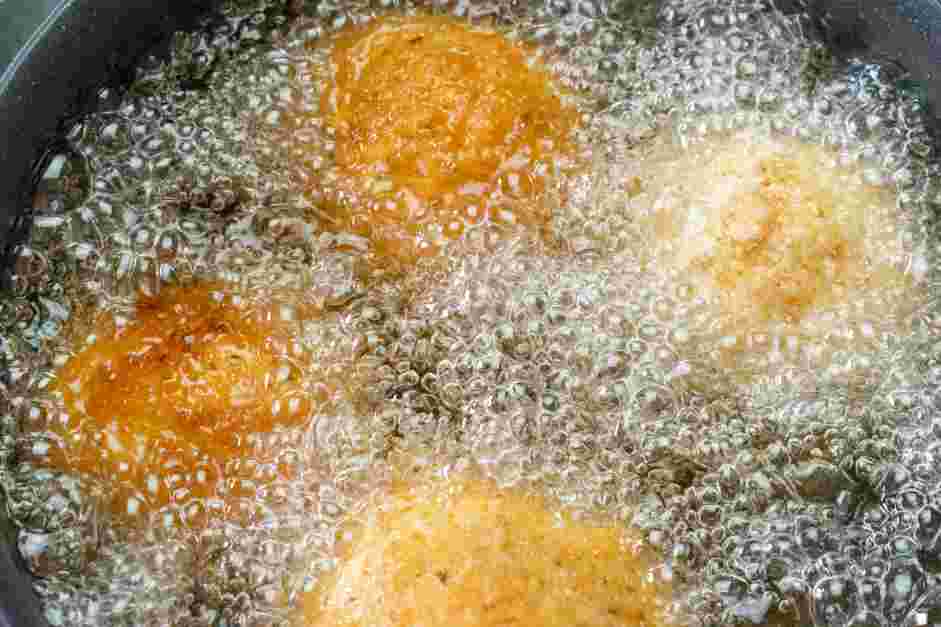 Italian Rice Balls Recipe: Heat the oil in a deep skillet to 350&deg;F.