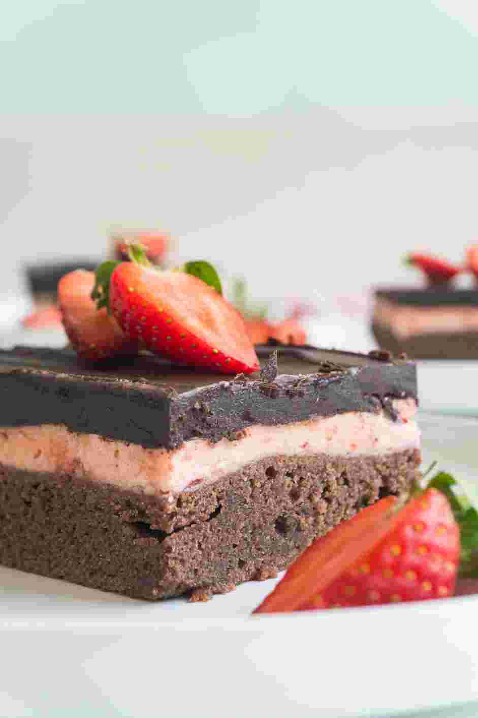 Strawberry Brownies Recipe: Cut the strawberry brownies into squares and top each brownie with a fresh strawberry.