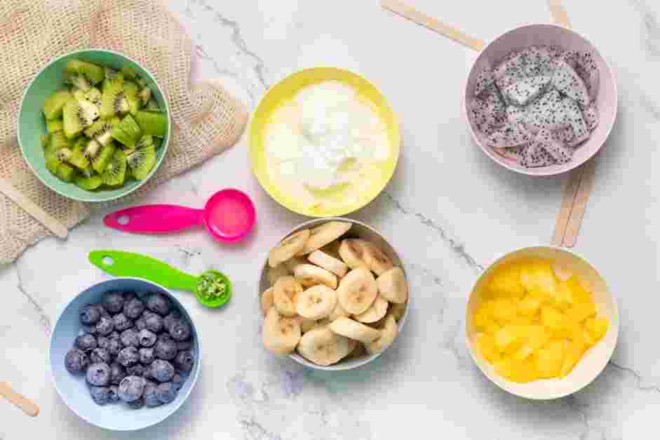 Rainbow Popsicles Recipe: Wash, dry and cut all fruit.