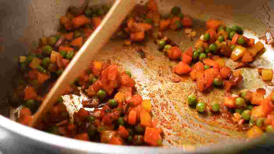 Spanish Rice and Beans Recipe: Once the oil is hot, add the onion, garlic and ginger.