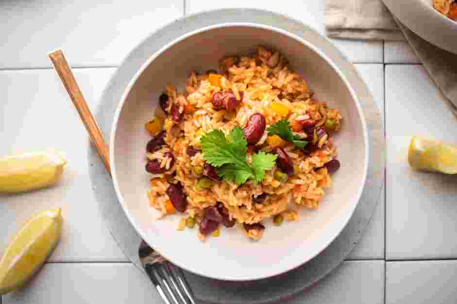 Spanish Rice and Beans Recipe: Next, stir in the rice and add the water.