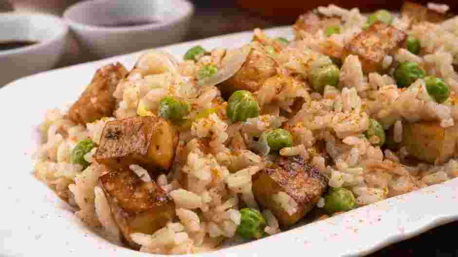 Vegan Fried Rice Recipe: Add the rice and frozen peas.