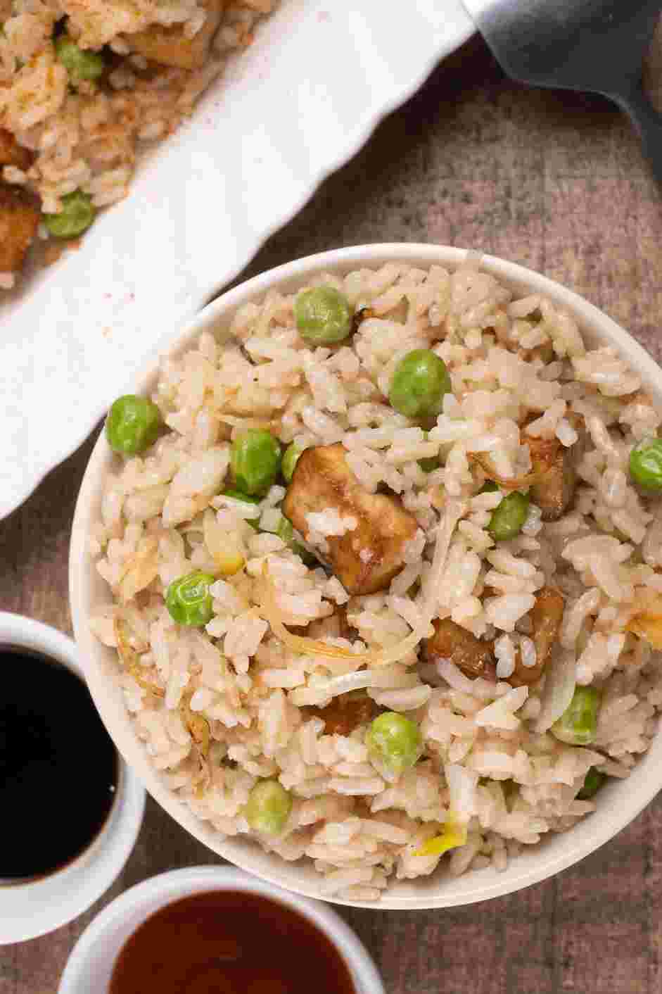 Vegan Fried Rice Recipe: Serve the vegan fried rice with soy sauce and Sriracha sauce as a condiment.