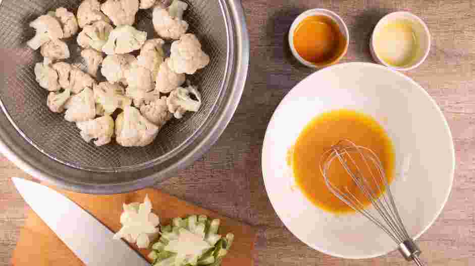 Air Fryer Buffalo Cauliflower Recipe: Blend together melted butter and Buffalo wing sauce in a mixing bowl.