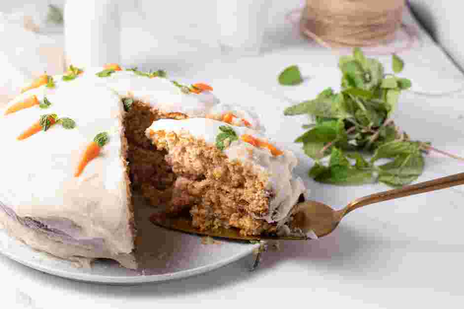 Vegan Carrot Cake Recipe: Decorate the cake by creating marzipan carrots and garnishing with mint, optional.