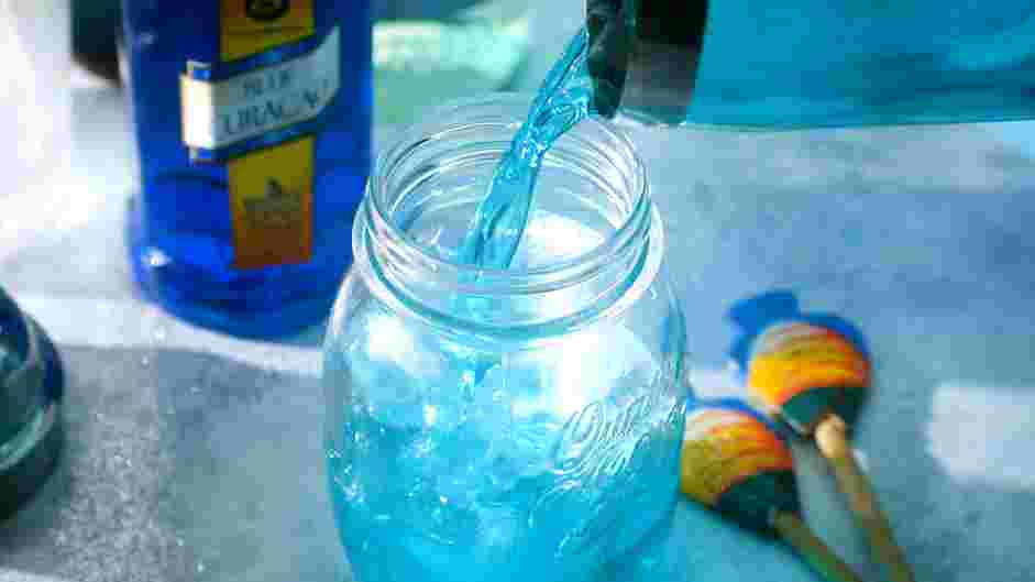 Shark Bite Cocktail Recipe: Gently mix with a long spoon.