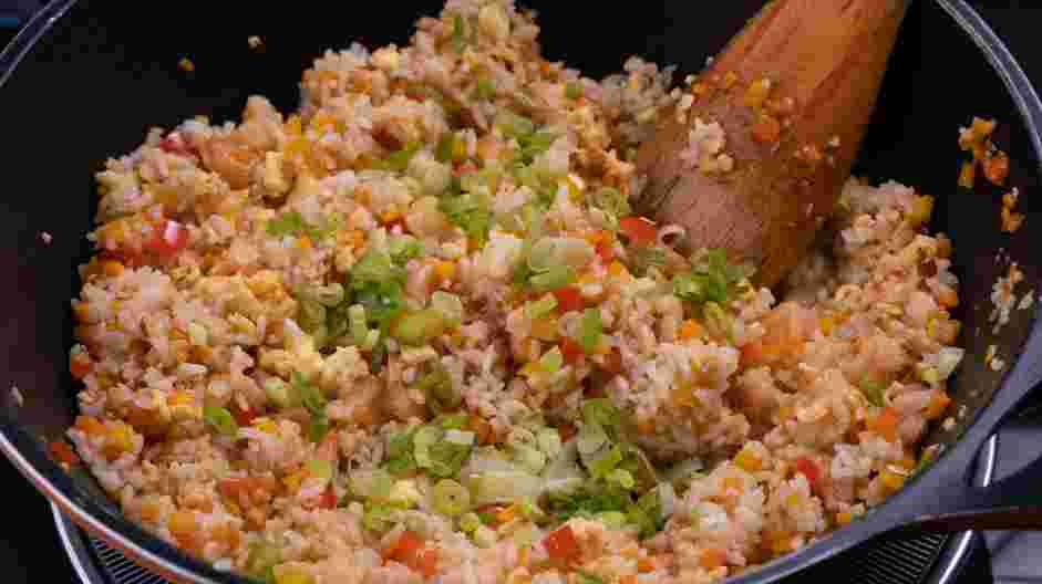 Hibachi Fried Rice Recipe: Toss in the rice and soy sauce until evenly combined and heated through.