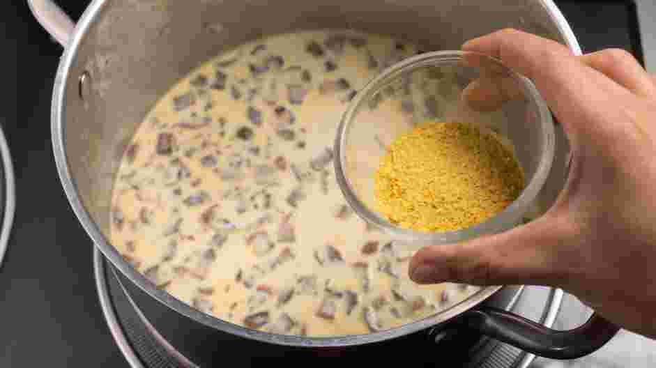 Vegan Mushroom Soup Recipe: Next, stir in the nutritional yeast, rice vinegar, thyme and liquid aminos.