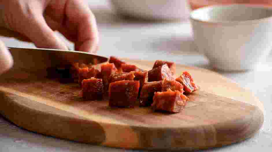Pisto Manchego Recipe: Heat one tablespoon of olive oil in a pan and sauté the chorizo over low heat for 5 minutes.