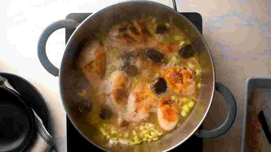 Estofado de Pollo Recipe: Place the chicken legs back into the pot, skin-side up.