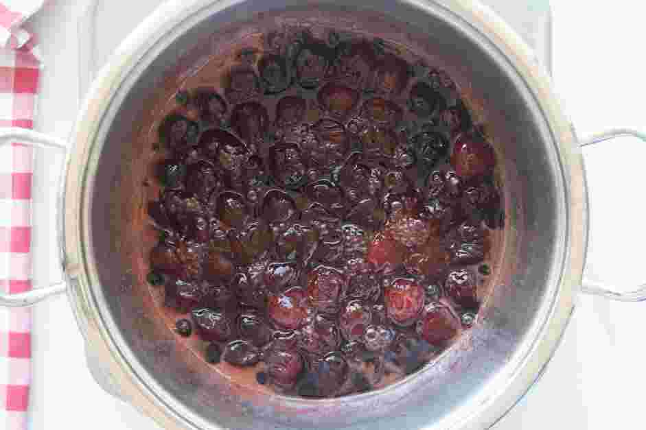 Candied Cherries Recipe: Over medium heat, bring the cherry-liquid mixture to a slow boil.