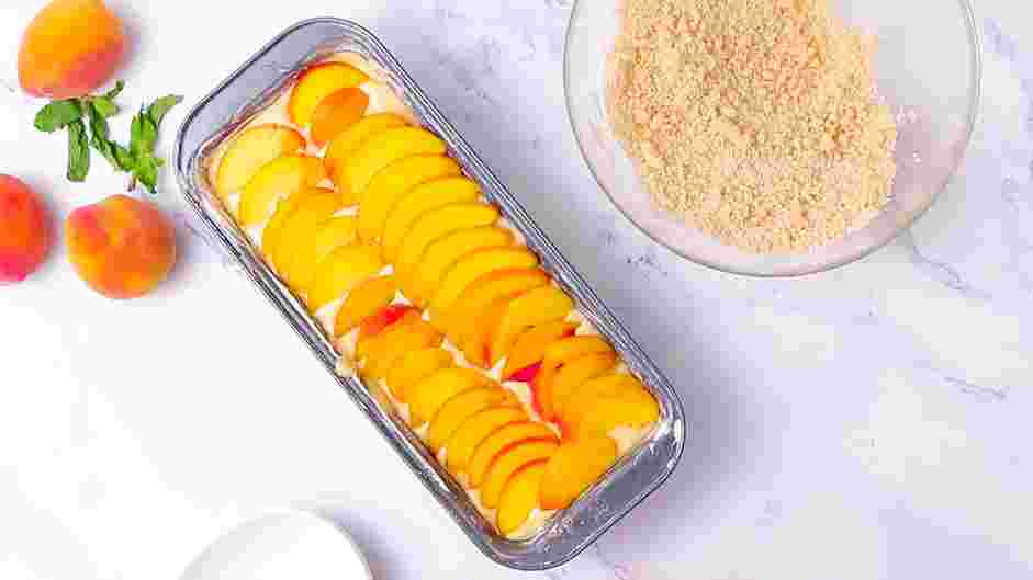 Peach Cobbler Pound Cake Recipe: Top the cake with the thinly sliced peaches.