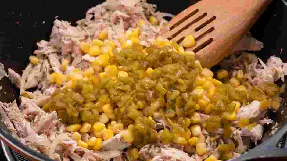 Chicken Taco Casserole Recipe: Add the diced green chili and frozen corn kernels.