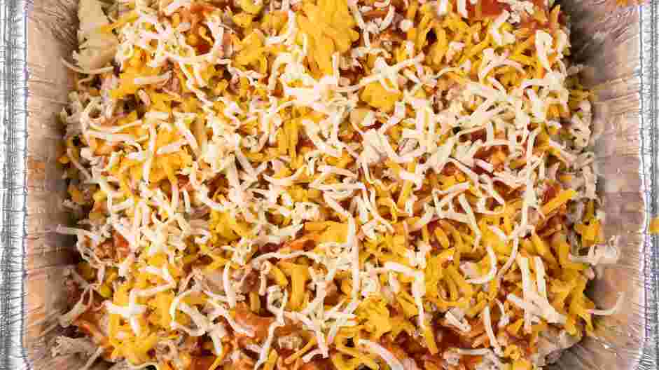 Chicken Taco Casserole Recipe: Sprinkle one cup of the Mexican cheese evenly.