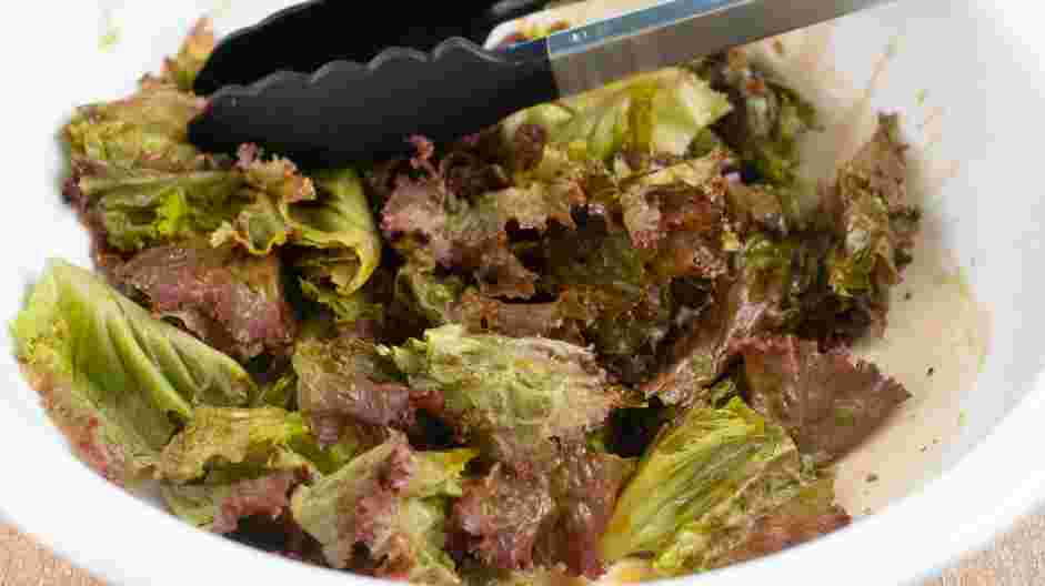 Bacon Roses Recipe: Toss salad greens in the bacon vinaigrette, then arrange on a platter.