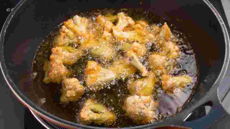 Buffalo Cauliflower Tacos Recipe: In a large sauté pan, heat the oil over medium heat.