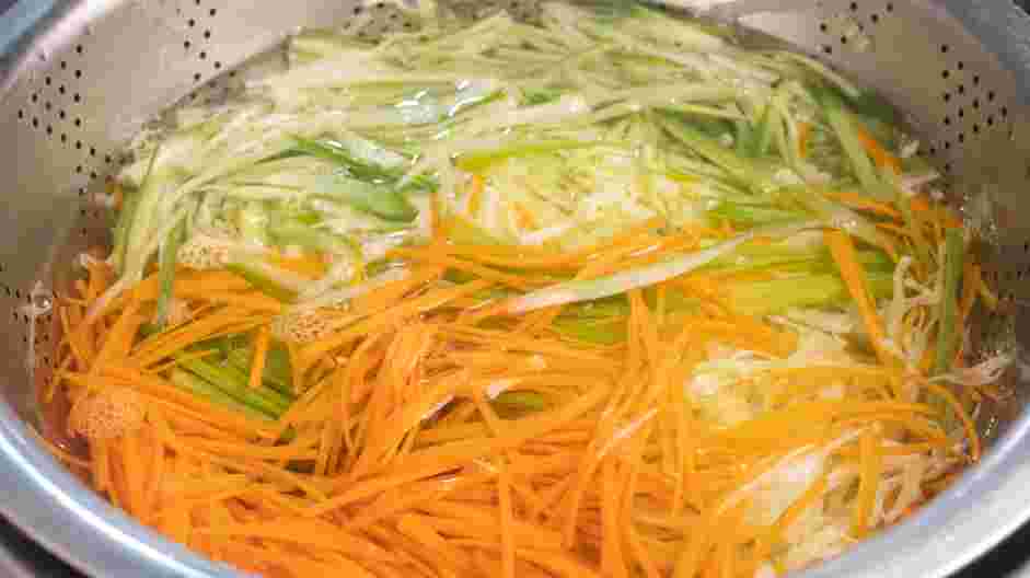 Jamaican Cabbage Recipe: In a large mixing bowl, add the cabbage, carrots, celery and cucumber.