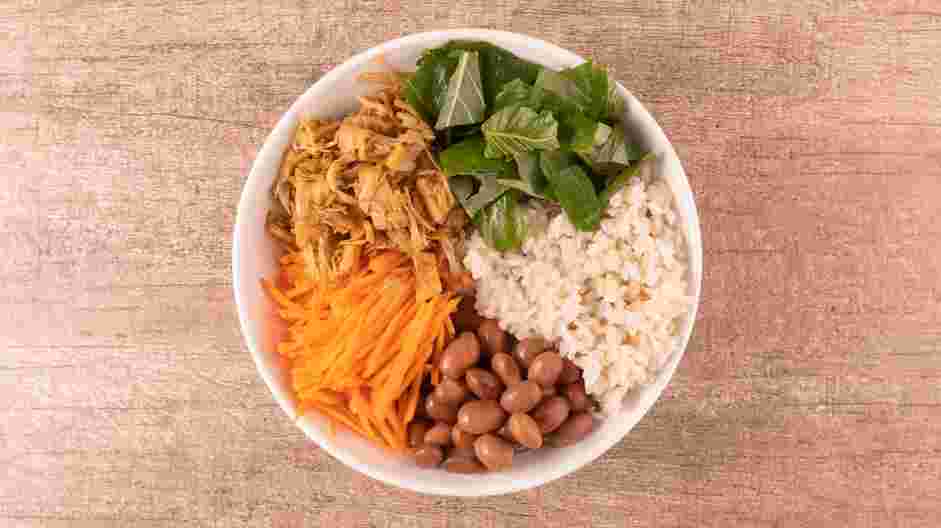 Vegan Burrito Bowl Recipe: In five bowls, distribute one-half cup of brown rice into each bowl.