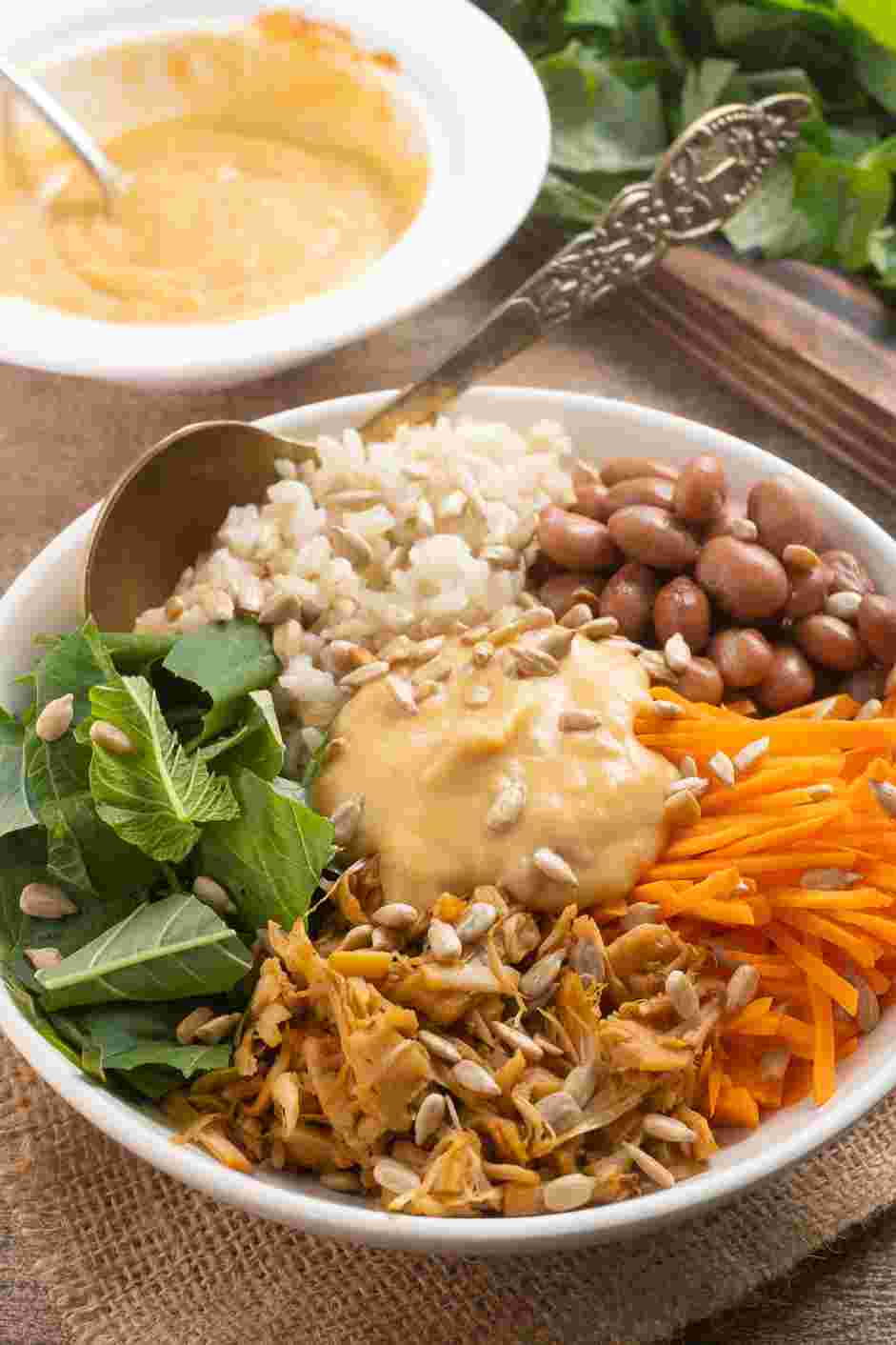 Vegan Burrito Bowl Recipe: Top the bowls with the salsa hummus.